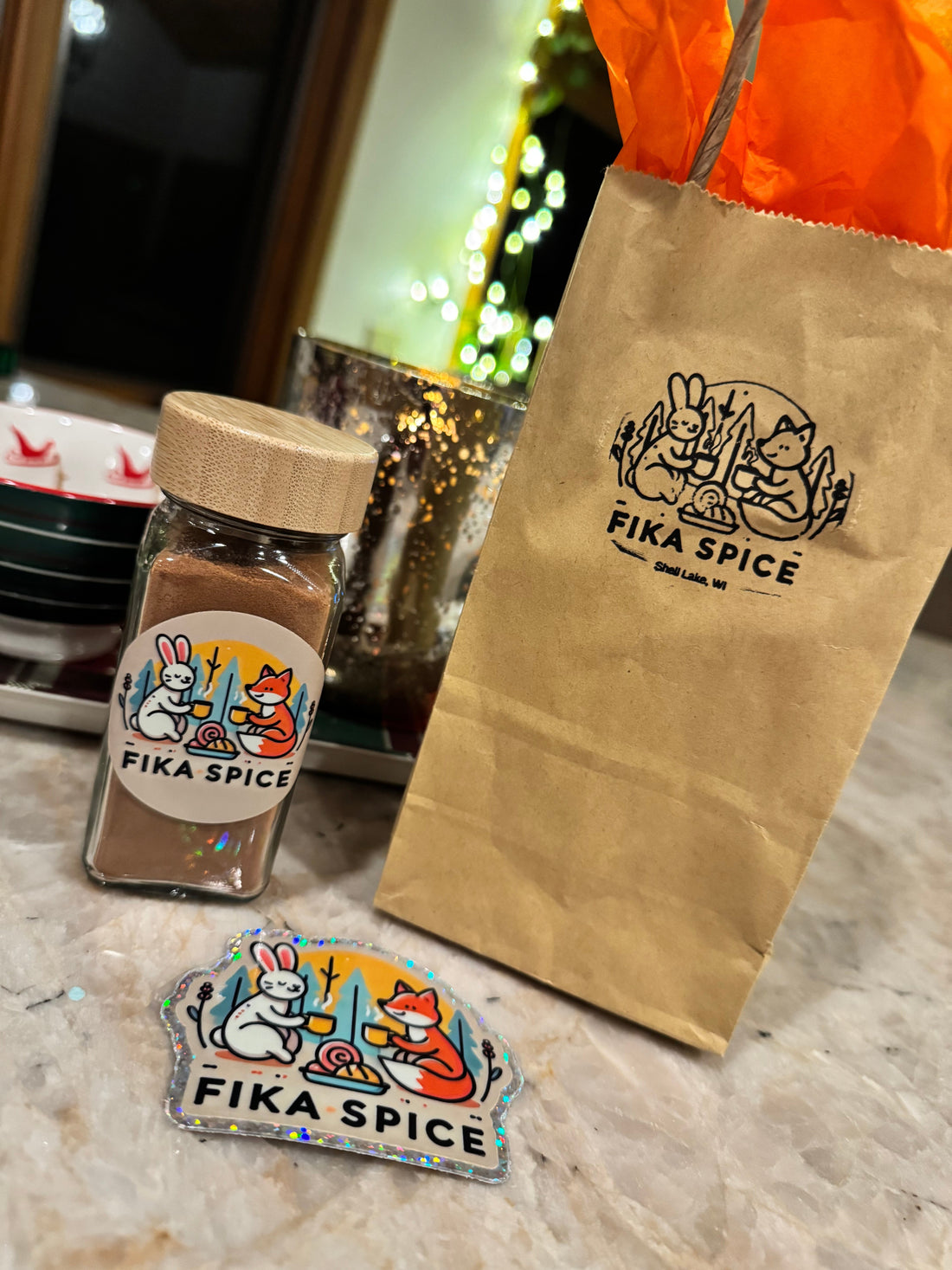 Gift bag of Fika Spice with Stcker in front of twinkling lights