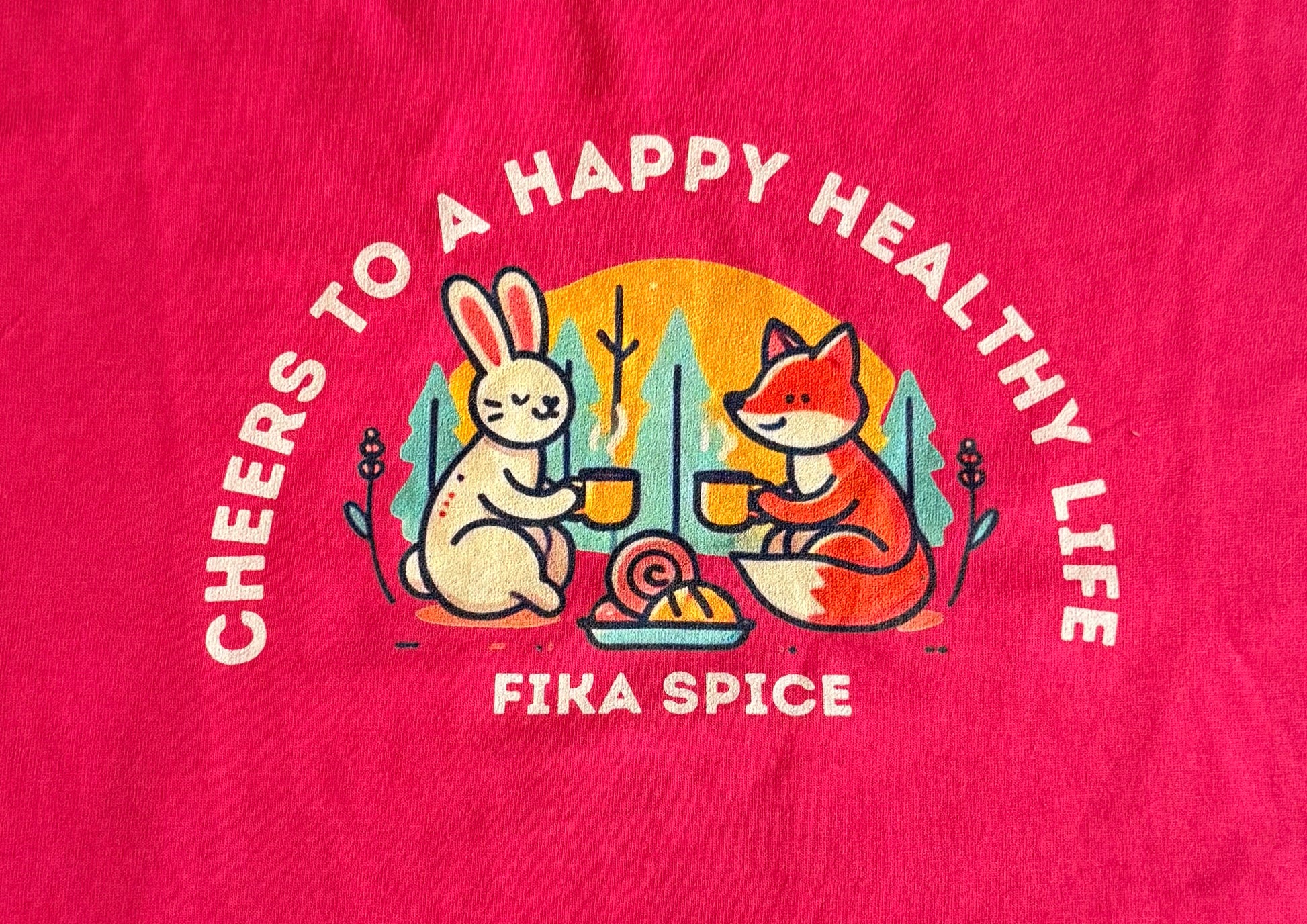 Fika Spice product with cartoon fox and rabbit design on a red background. Fika Spice Scandinavian coffee spice blend with cinnamon and cardamom crated with antioxidant-rich spices for a daily healthy treat.