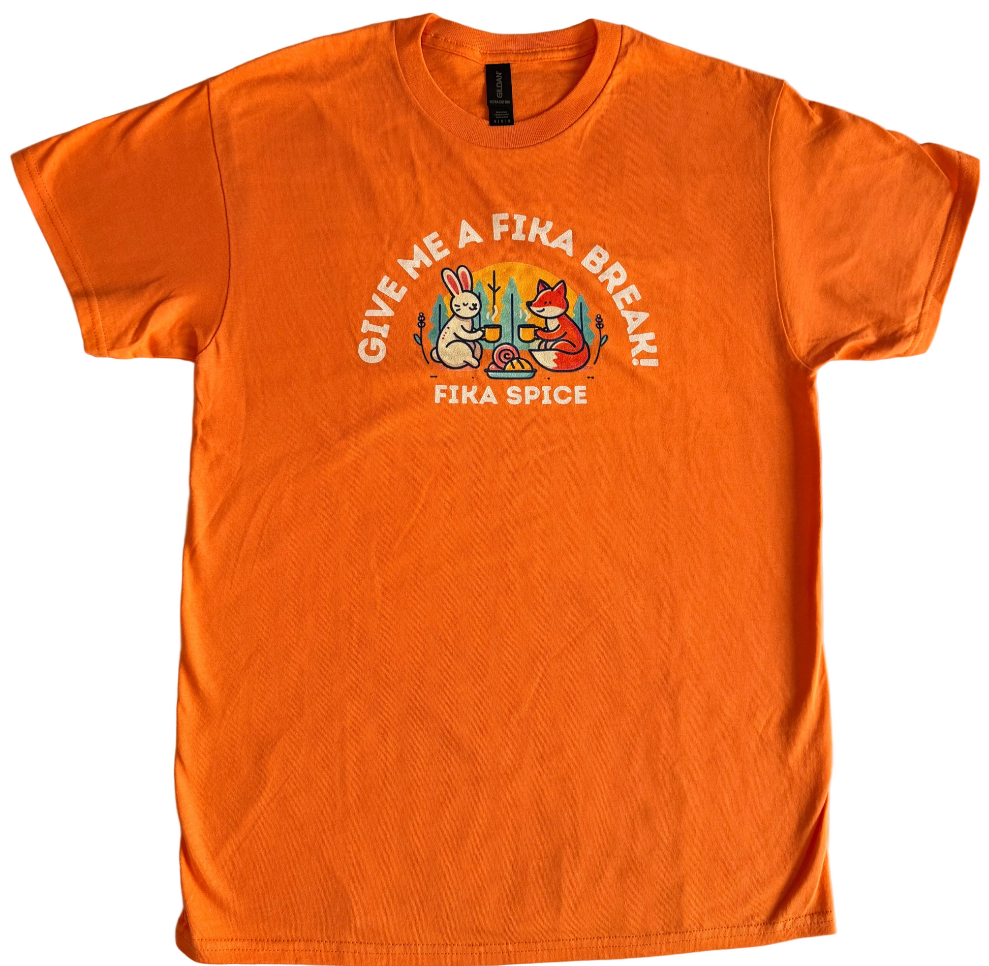 Orange t-shirt with graphic design and text on a white background. Fika Spice Scandinavian coffee spice blend with cinnamon and cardamom crated with antioxidant-rich spices for a daily healthy treat.